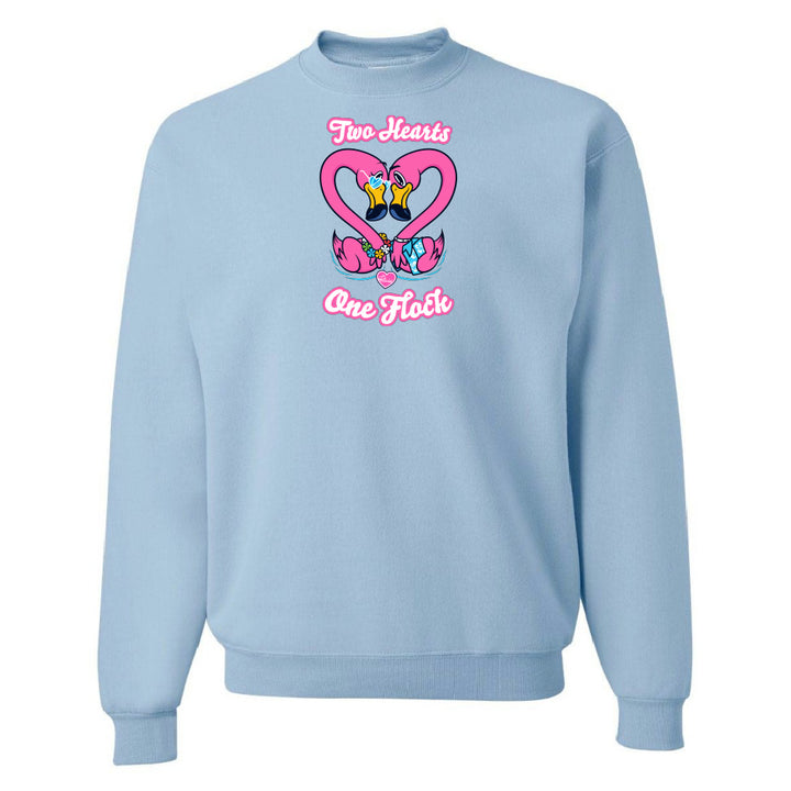Light blue sweatshirt with a heart design and text on a white background