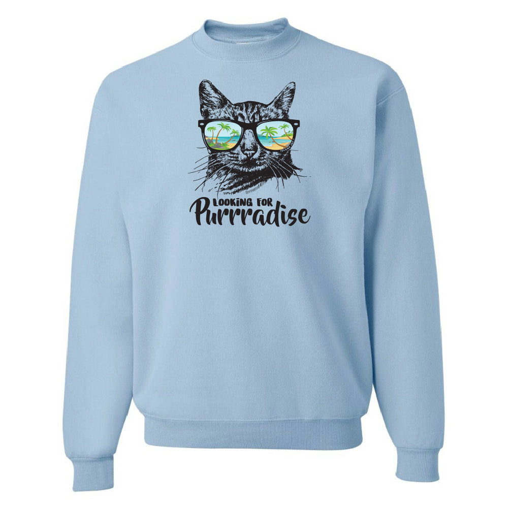 Light blue sweatshirt with a cat graphic and 'Looking for Purradise' text on a white background