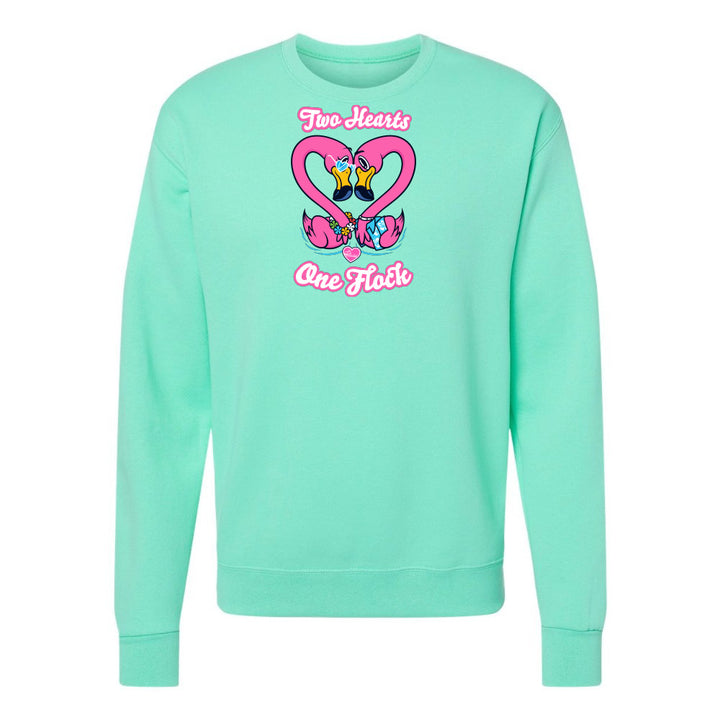 Mint green sweatshirt with heart design and text on a white background