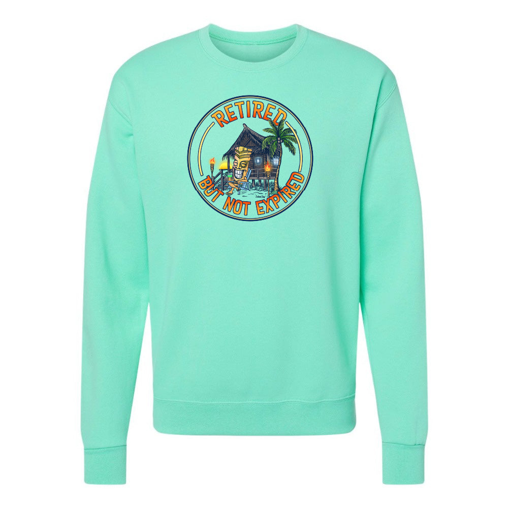 Mint green sweatshirt with a tropical design and 'Retired but not expired' text on a white background