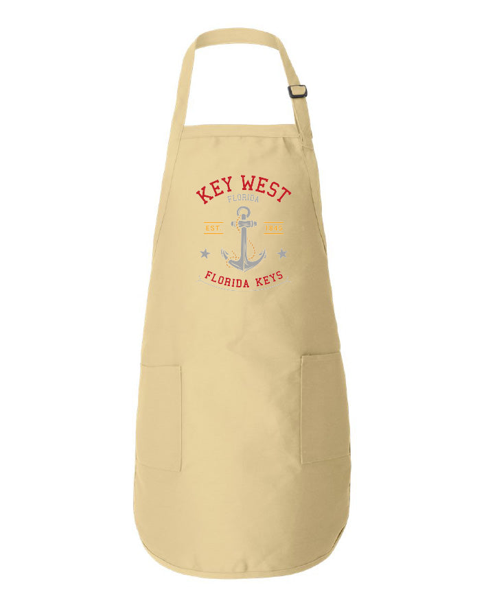 Beige apron with 'Key West Florida Keys' text and anchor graphic on a white background