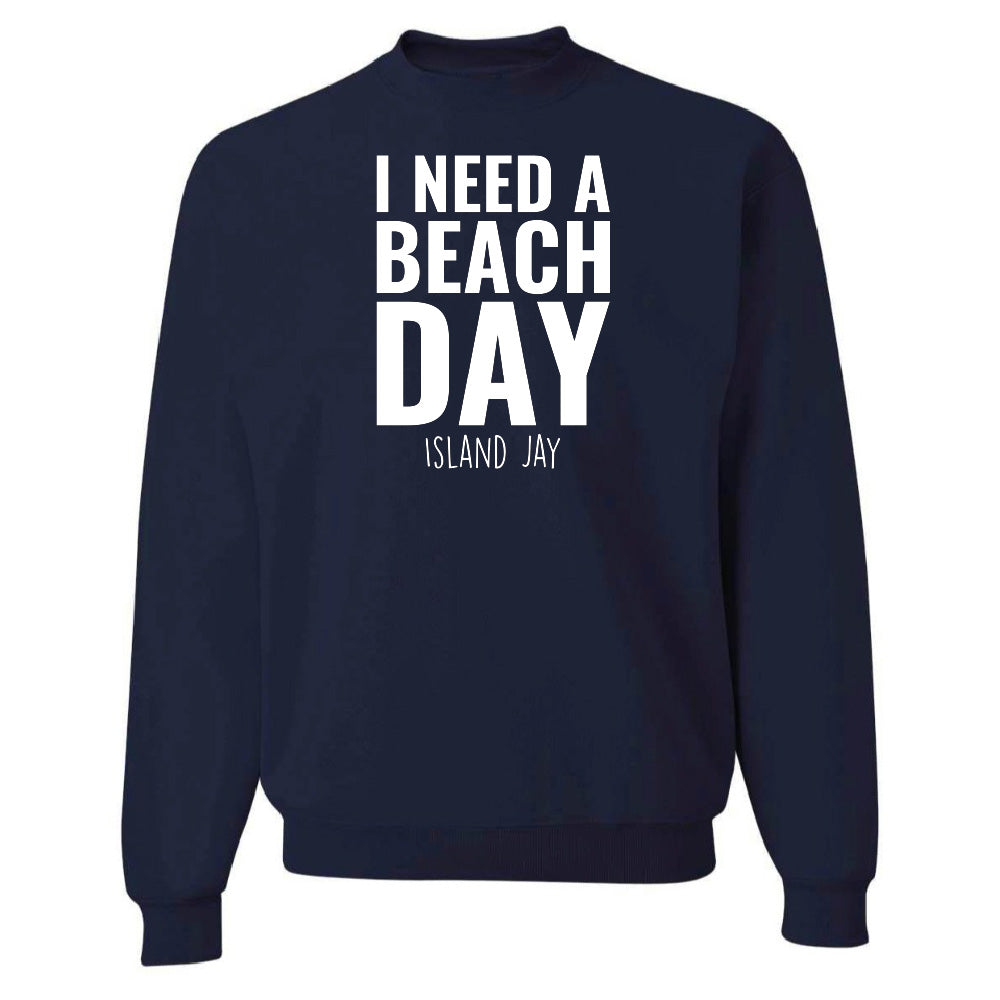 Navy blue sweatshirt with 'I NEED A BEACH DAY' text on a white background