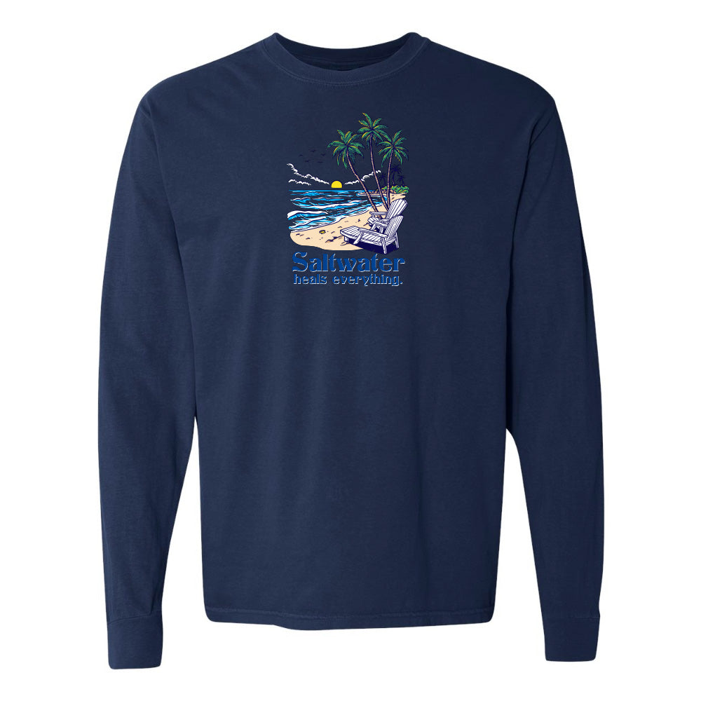 Navy blue long-sleeve shirt with a beach graphic and 'Saltwater has everything' text on a white background