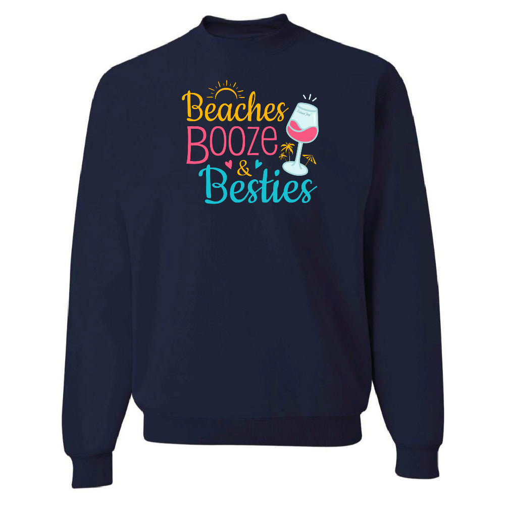 Navy blue sweatshirt with 'Beaches Booze & Besties' text and graphics on a white background