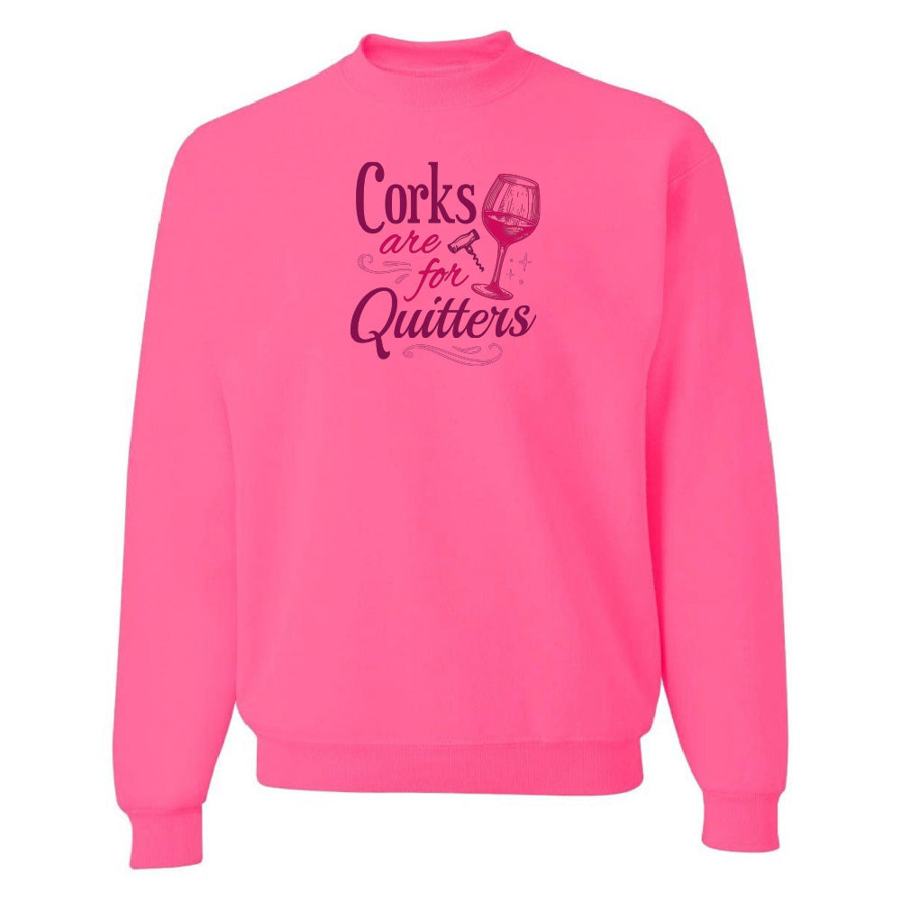 Pink sweatshirt with text 'Corks are for Quitters' on a white background
