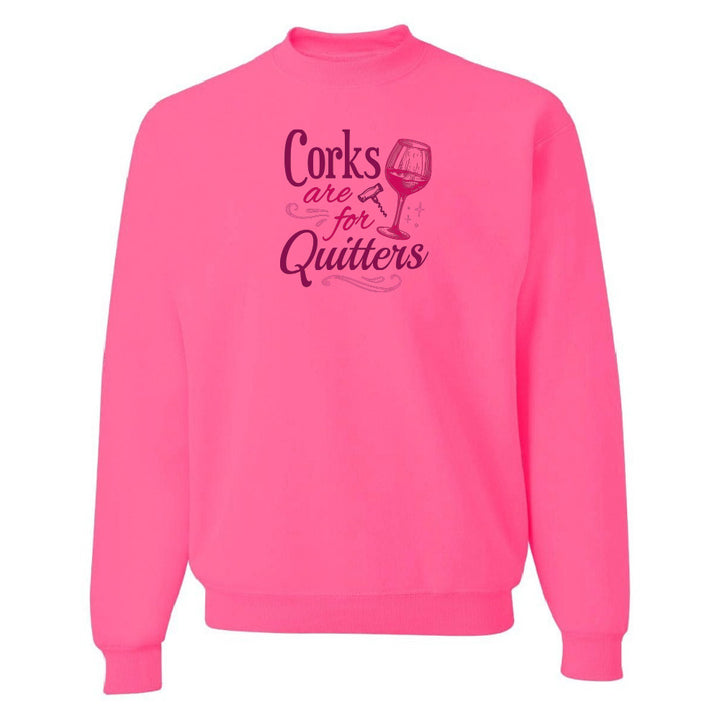 Pink sweatshirt with text 'Corks are for Quitters' on a white background