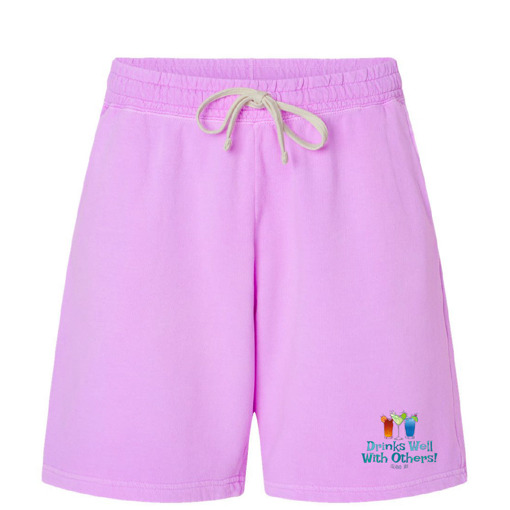Purple shorts with a colorful graphic and text on a white background