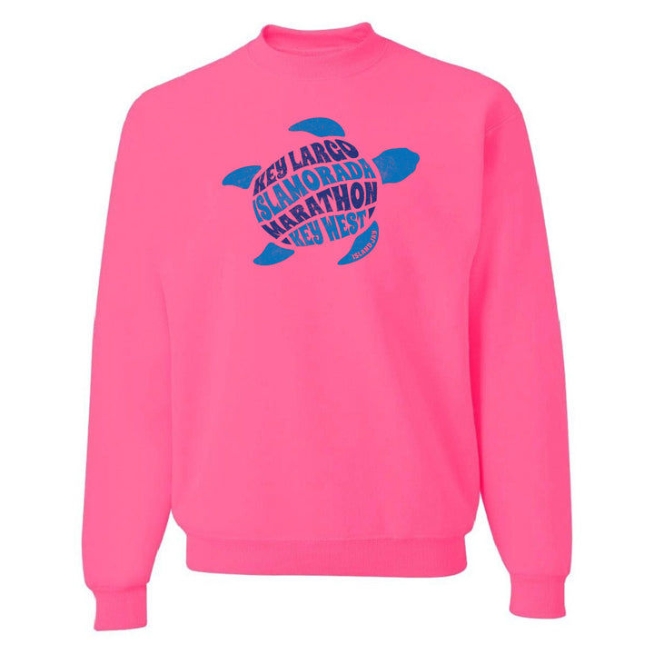Pink sweatshirt with blue turtle graphic and text on a white background
