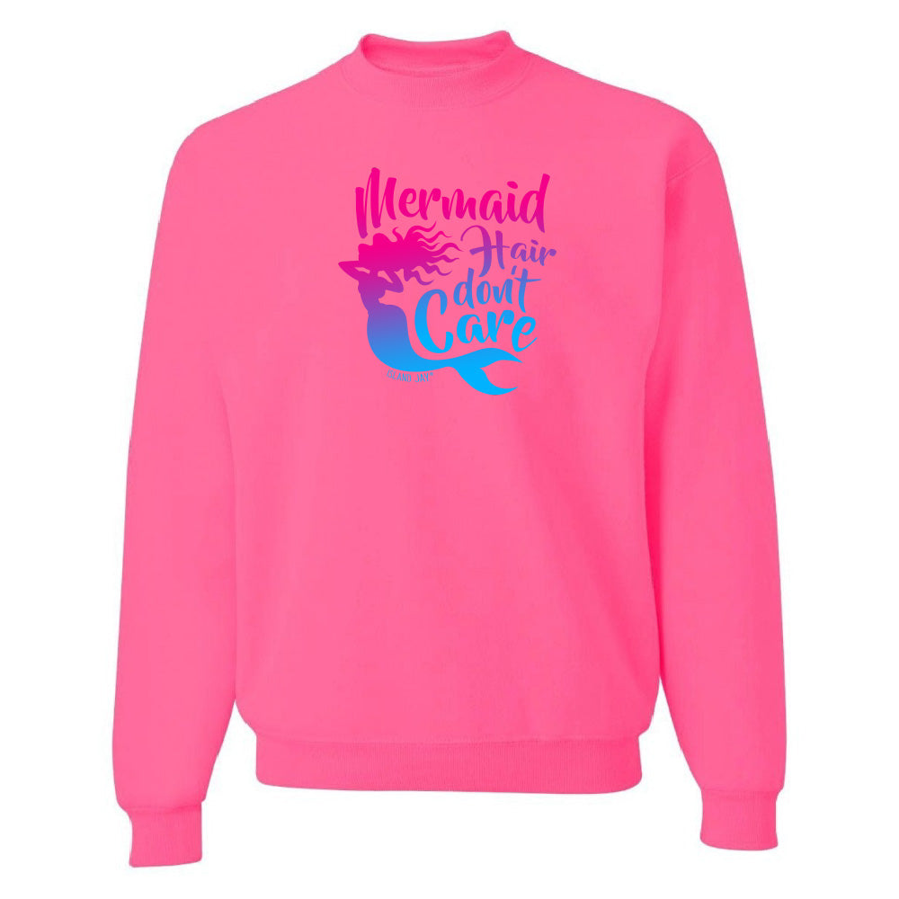 Pink sweatshirt with mermaid graphic and text on a white background
