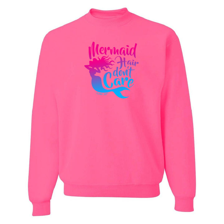 Pink sweatshirt with mermaid graphic and text on a white background