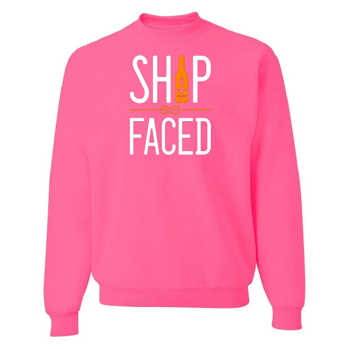 Pink sweatshirt with 'SHIP FACED' text and bottle graphic on a white background