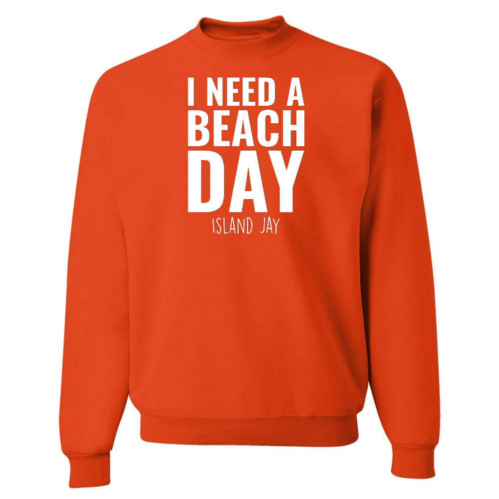 Orange sweatshirt with 'I NEED A BEACH DAY' text on a white background