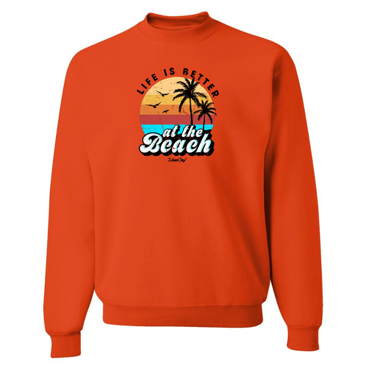 Orange sweatshirt with beach-themed design on a white background