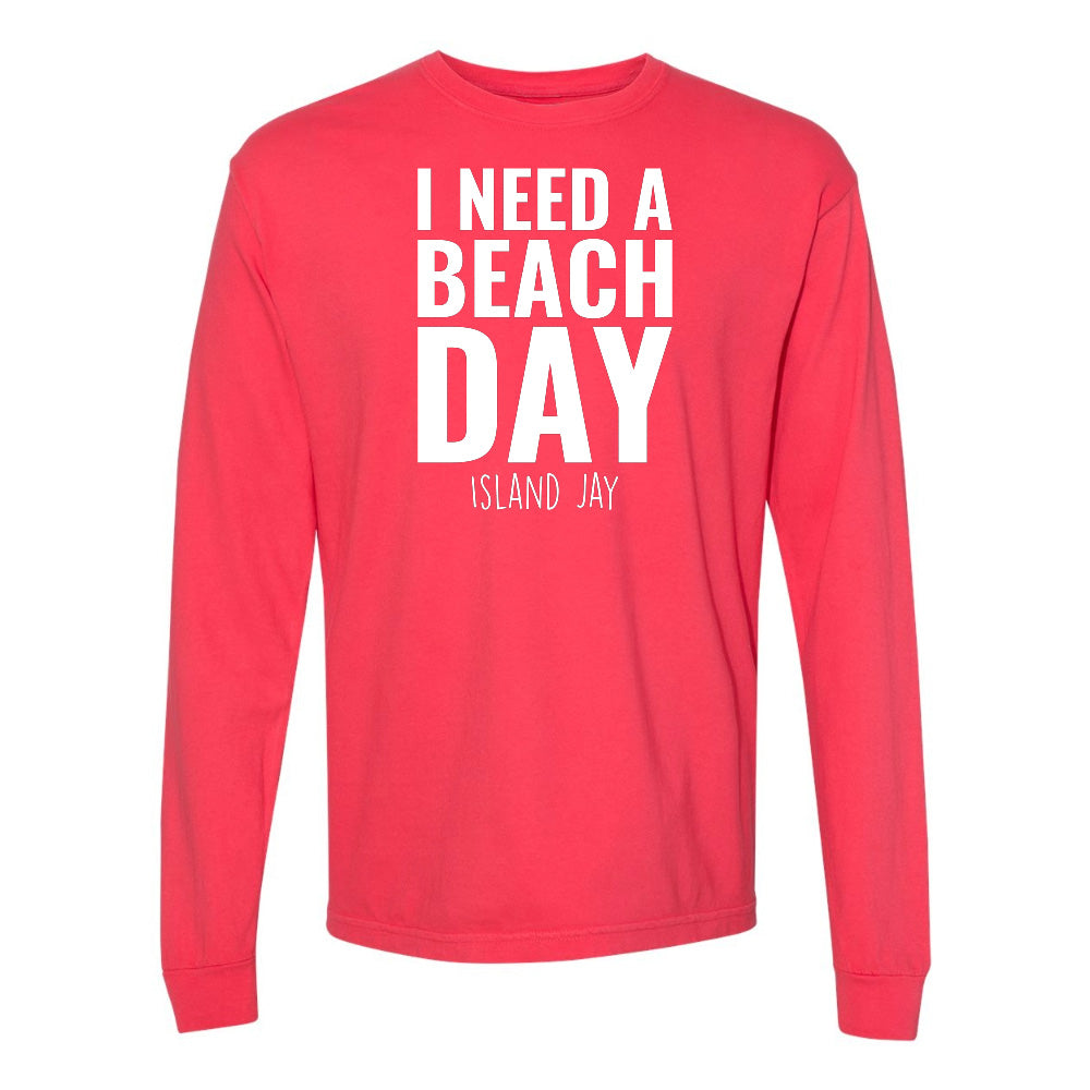 Red long-sleeve shirt with 'I NEED A BEACH DAY' text on a white background