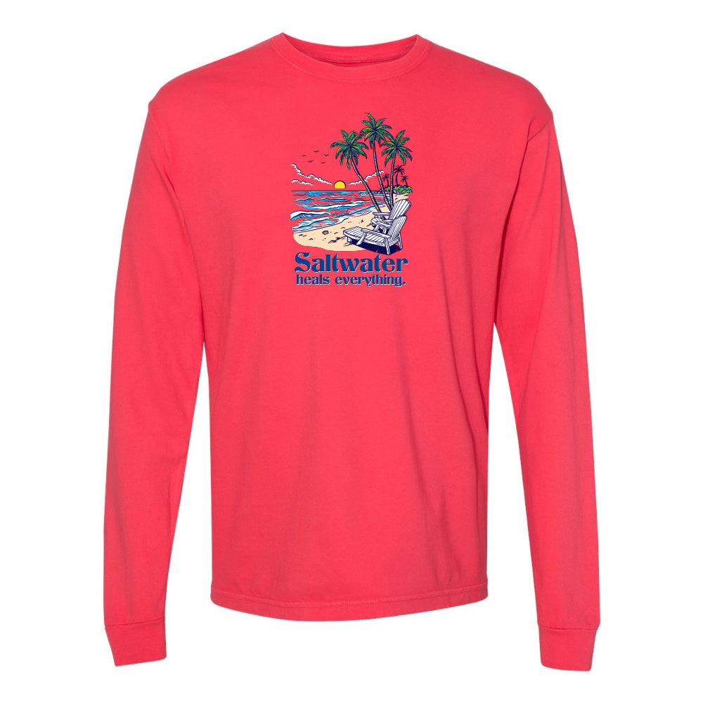 Red long-sleeve shirt with a beach graphic and 'Saltwater heals everything' text on a white background