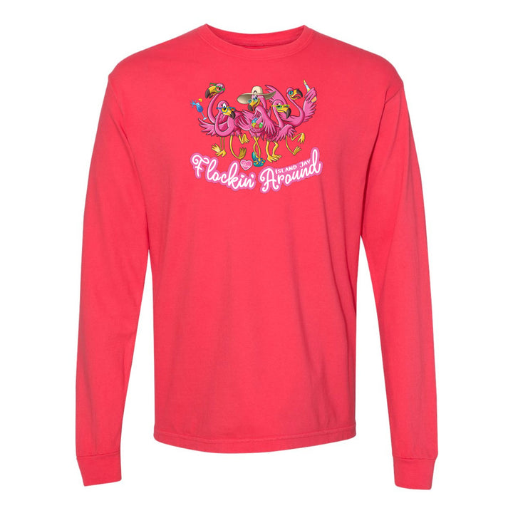 Red long-sleeve shirt with flamingo design and text on a white background