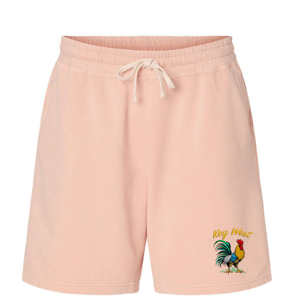 Pink shorts with a rooster graphic and 'Key West' text on a white background