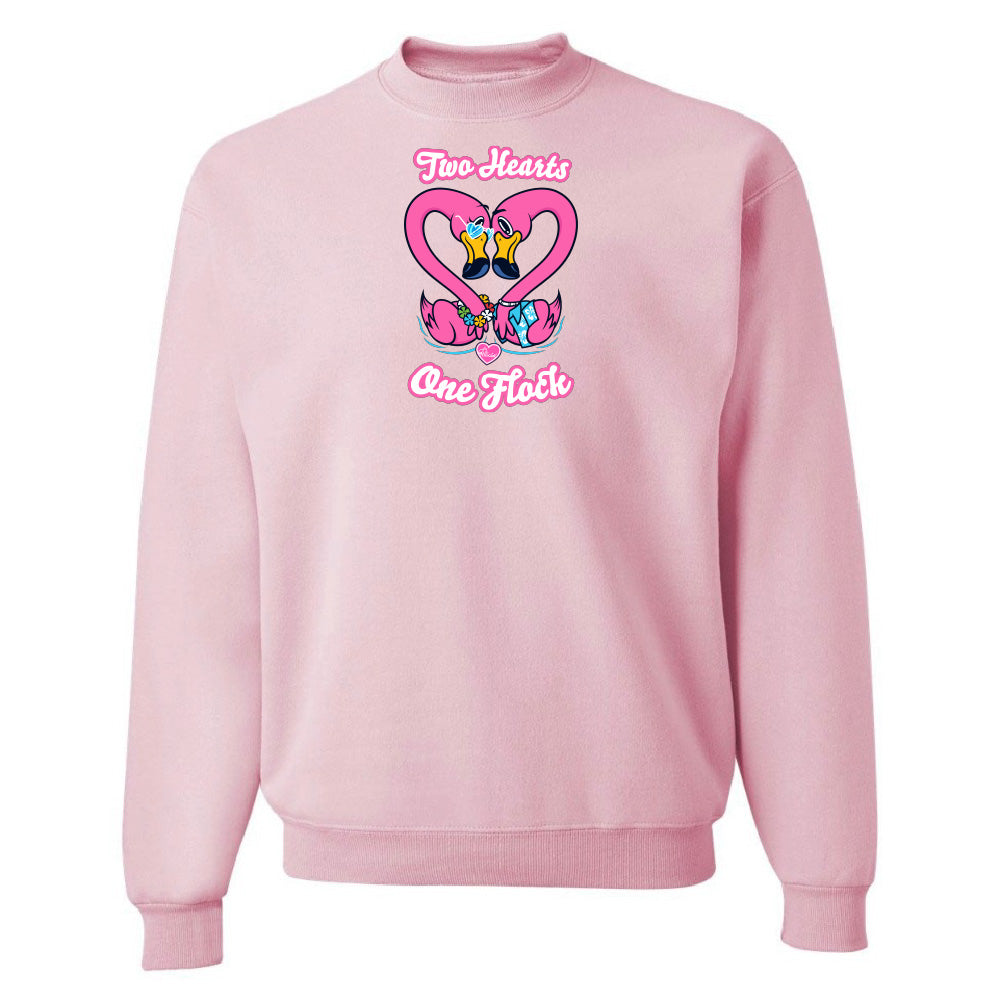 Pink sweatshirt with a heart design and text on a white background