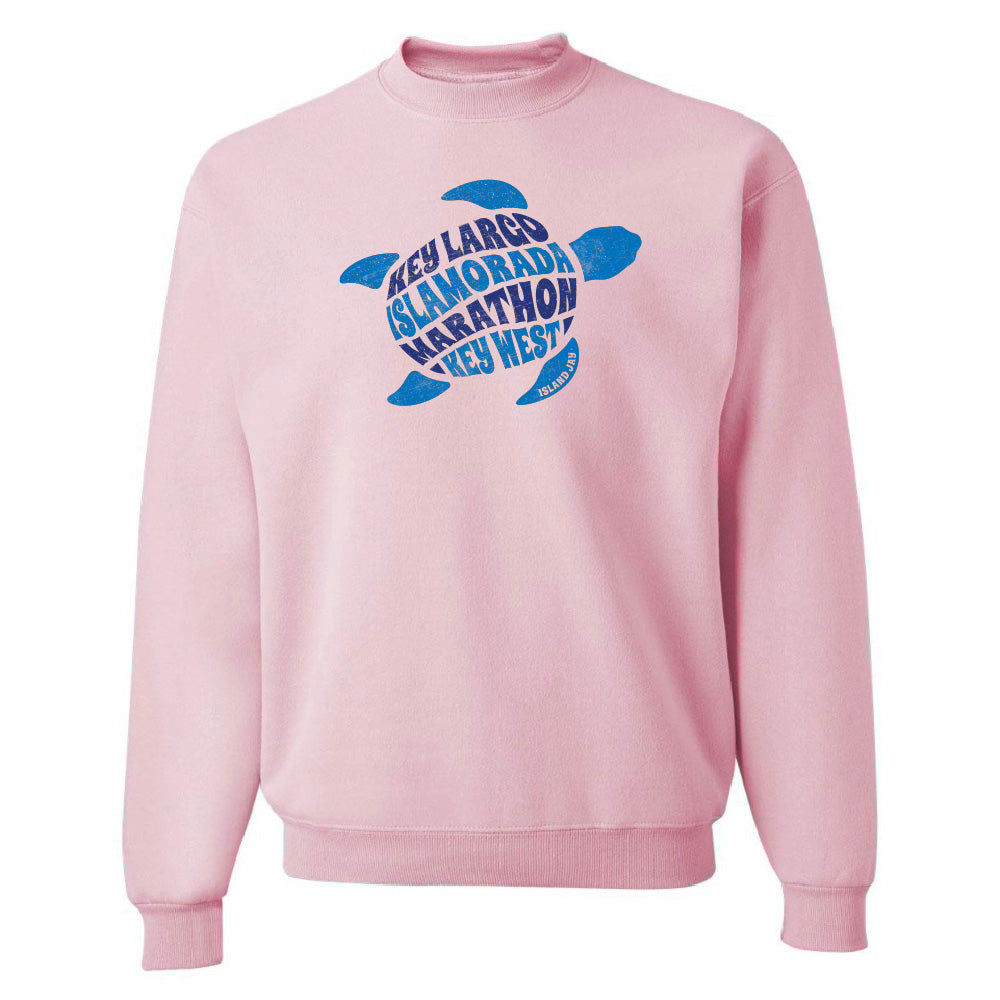 Pink sweatshirt with blue turtle design and text on a white background