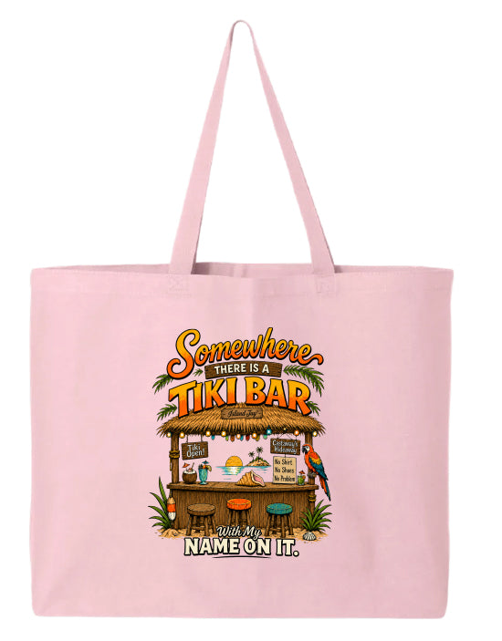 A light pink canvas tote bag featuring a colorful graphic of a tropical tiki bar with the text 'Somewhere there is a TIKI BAR and my name on it.' on a plain white background.