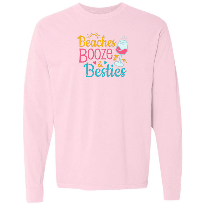 Pink sweatshirt with 'Beaches Booze & Besties' text and wine glass graphic on a white background