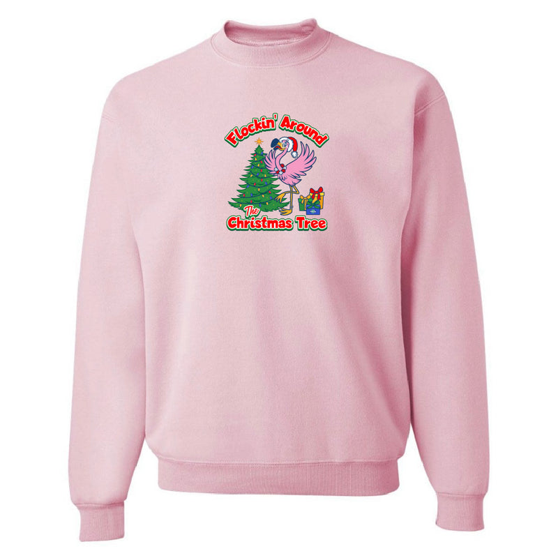 Pink sweatshirt with a Christmas-themed graphic on a white background