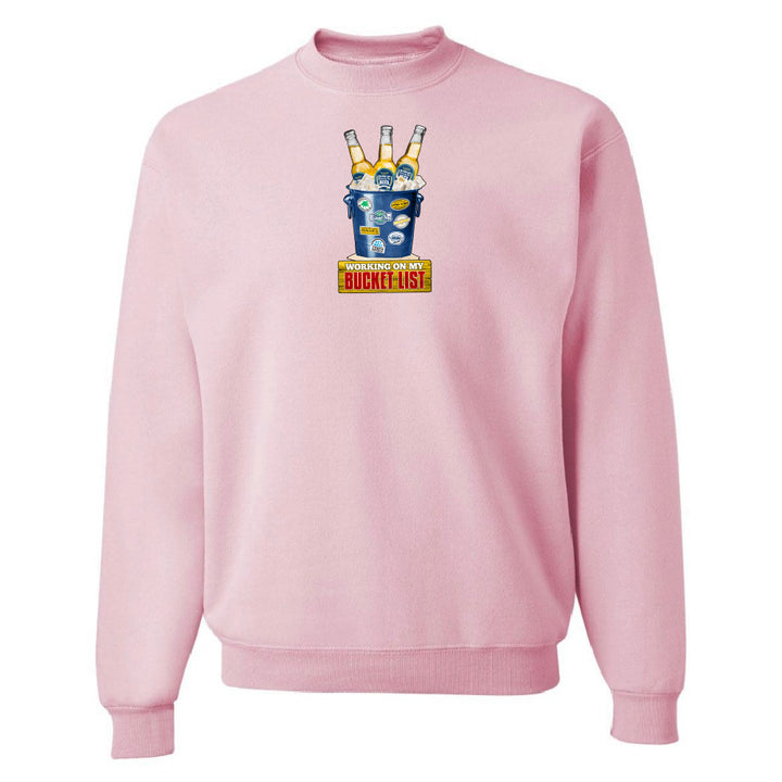 Pink sweatshirt with a graphic design on a white background