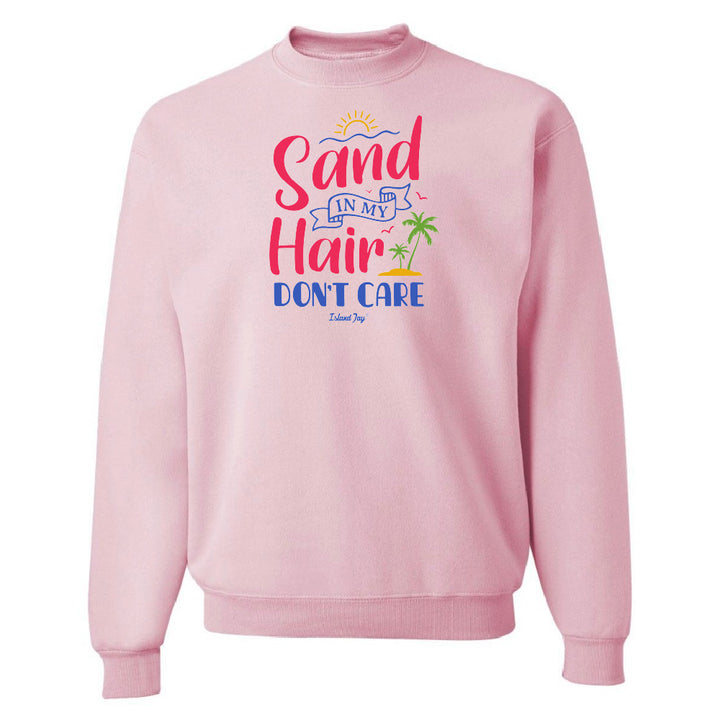 Pink sweatshirt with 'Sand in my Hair Don't Care' text and graphics on a white background