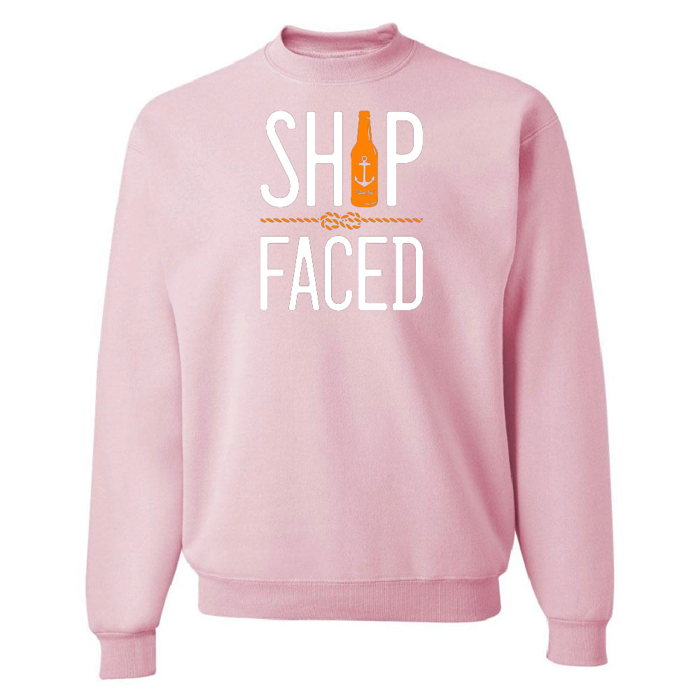 Pink sweatshirt with 'Ship Faced' text and bottle graphic on a white background