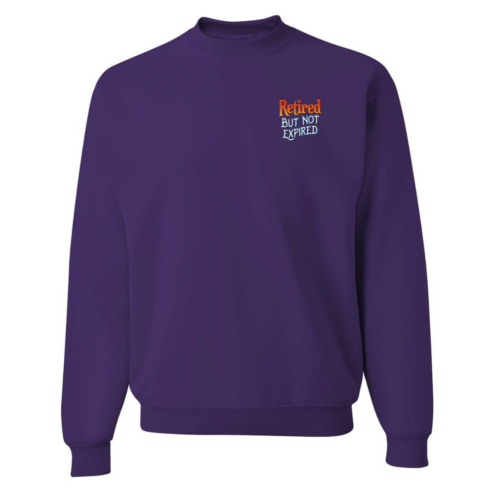 Purple sweatshirt with 'Retired But Not Expired' text on a white background