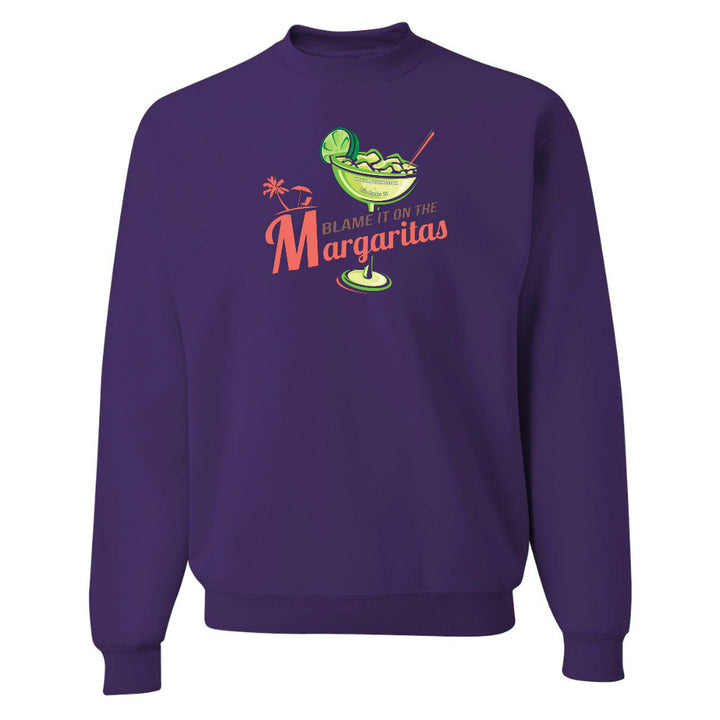 Purple sweatshirt with a graphic design and text on a white background