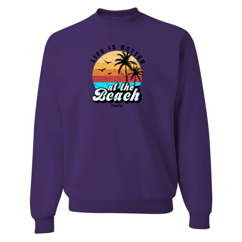Purple sweatshirt with 'Life is Better at the Beach' graphic on a white background