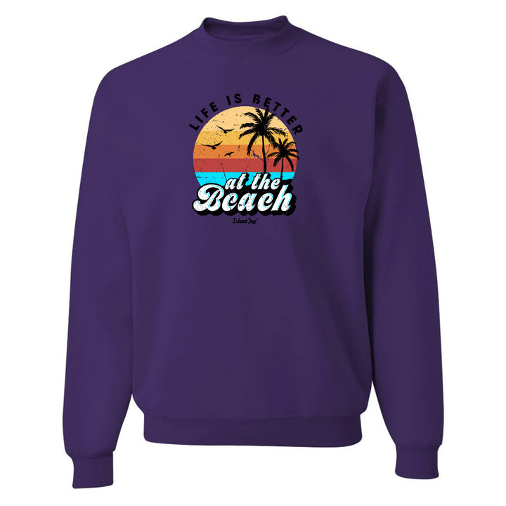 Purple sweatshirt with 'Life is Better at the Beach' graphic on a white background