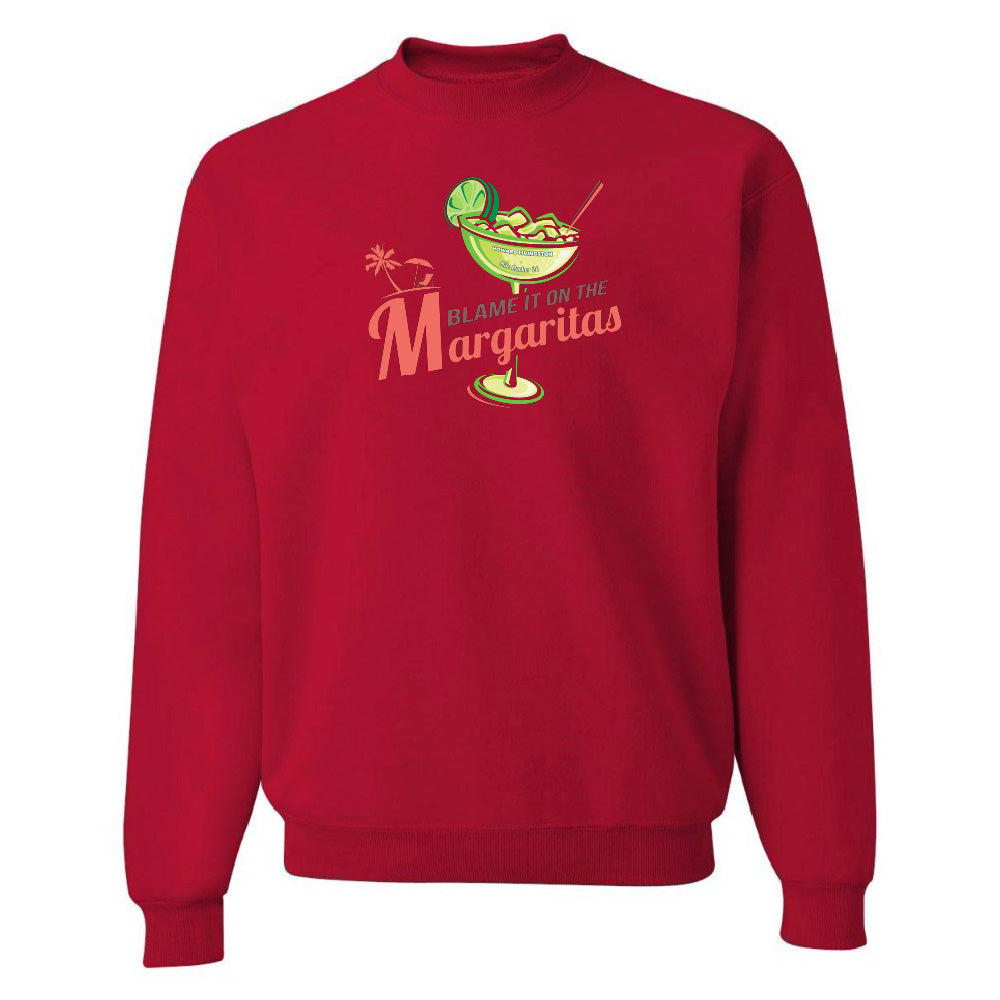 Red sweatshirt with a graphic of a margarita and text 'Blame it on the Margaritas' on a white background
