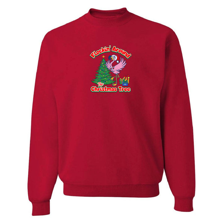 Red sweatshirt with Christmas-themed design featuring a parrot and tree on a white background