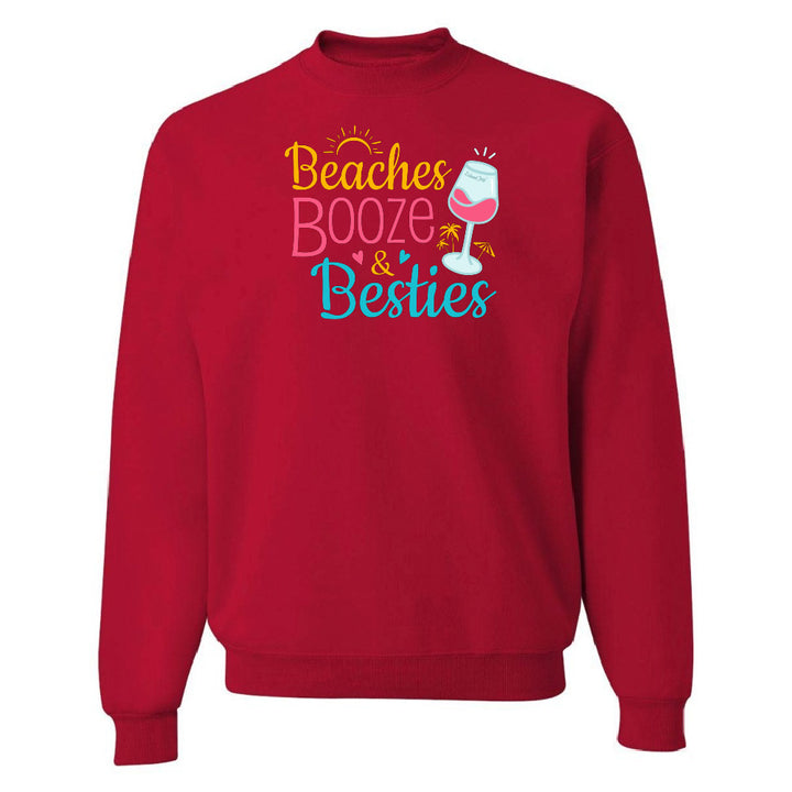 Red sweatshirt with 'Beaches Booze & Besties' text and a wine glass graphic on a white background
