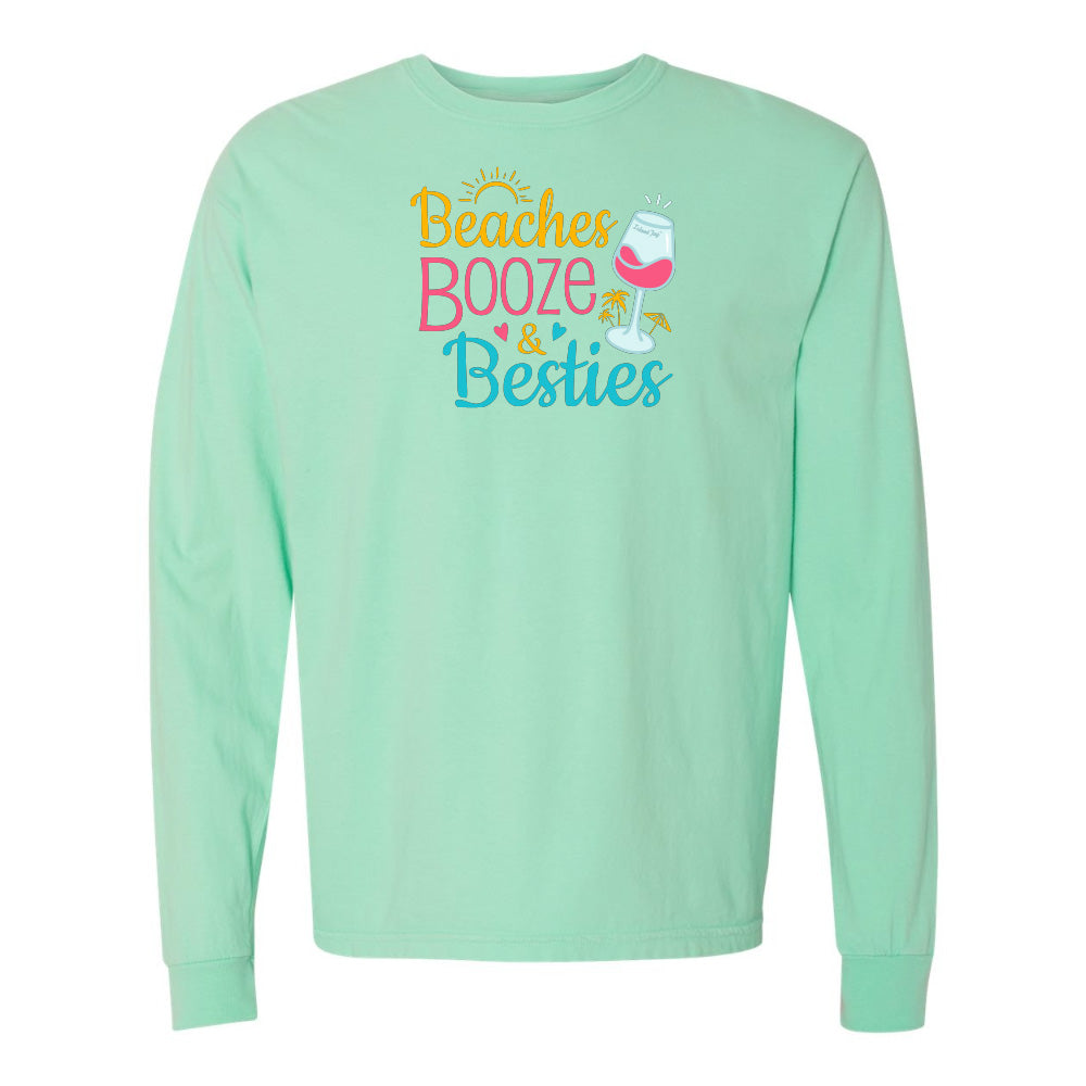 Mint green long-sleeve shirt with 'Beaches Booze & Besties' text and graphics on a white background