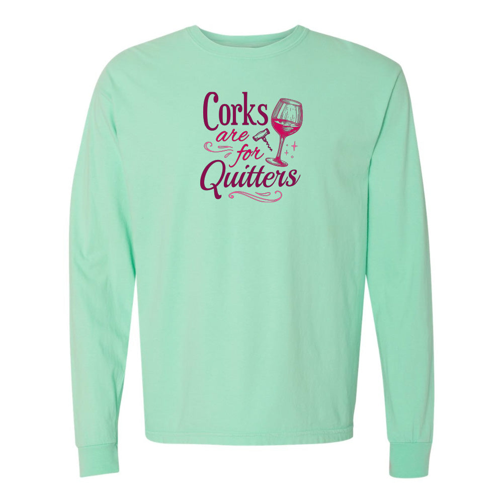 Mint green long-sleeve shirt with pink text and wine glass graphic on a white background