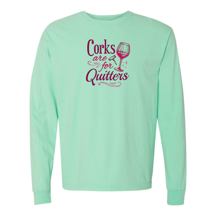 Mint green long-sleeve shirt with pink text and wine glass graphic on a white background