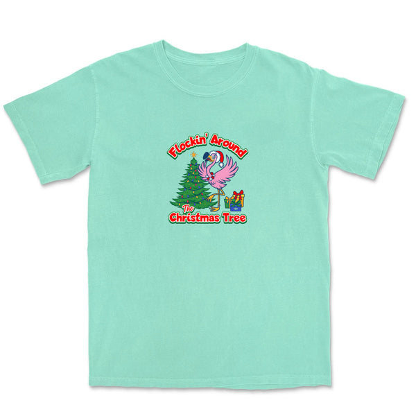 Mint green t-shirt with a Christmas-themed graphic and text 