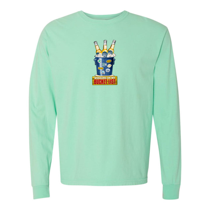 Mint green long-sleeve shirt with a graphic design on a white background