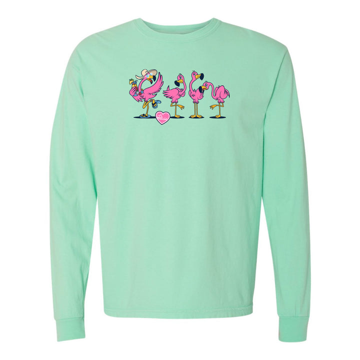 Mint green long-sleeve shirt with pink flamingo design on a white background