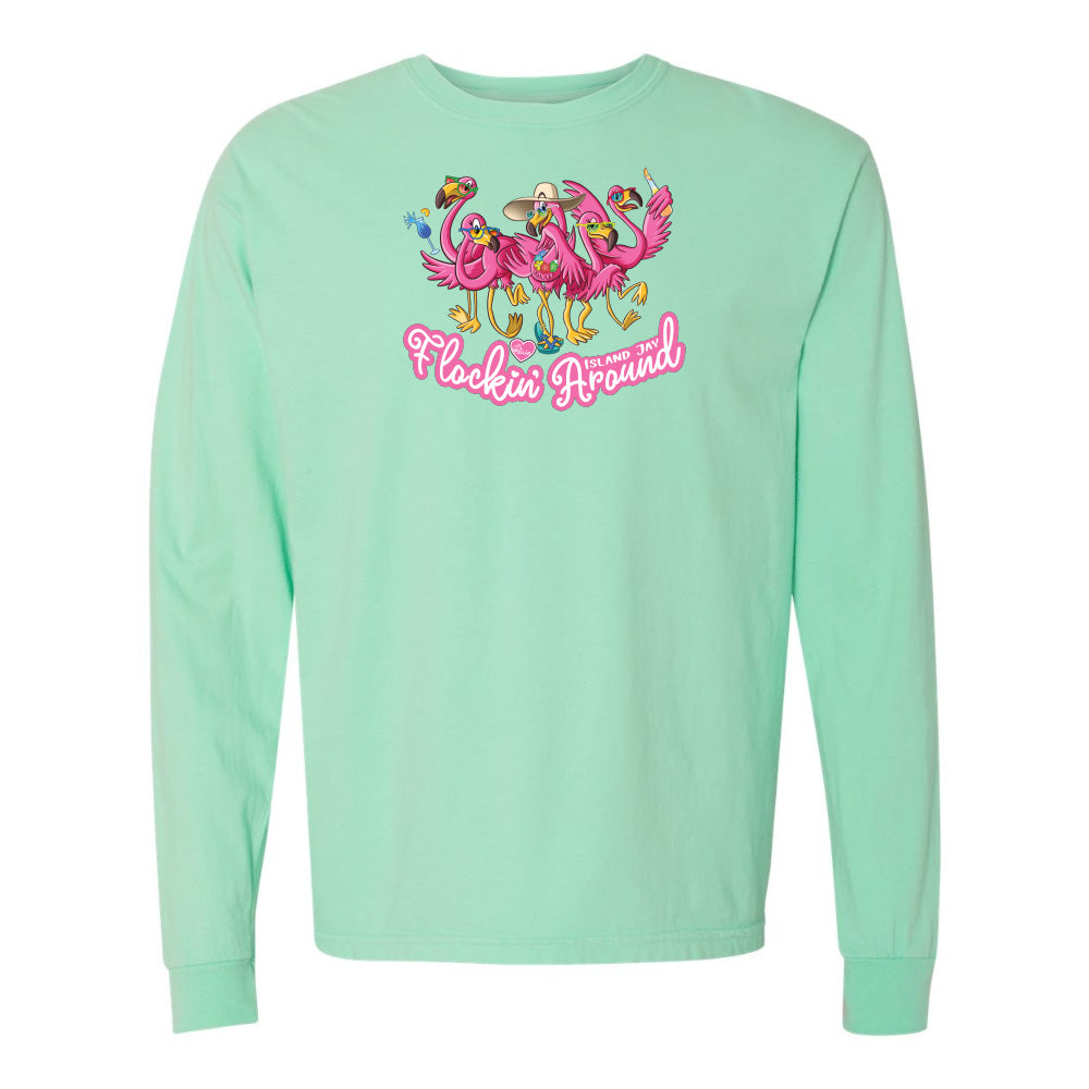 Mint green long-sleeve shirt with flamingo design and text on a white background
