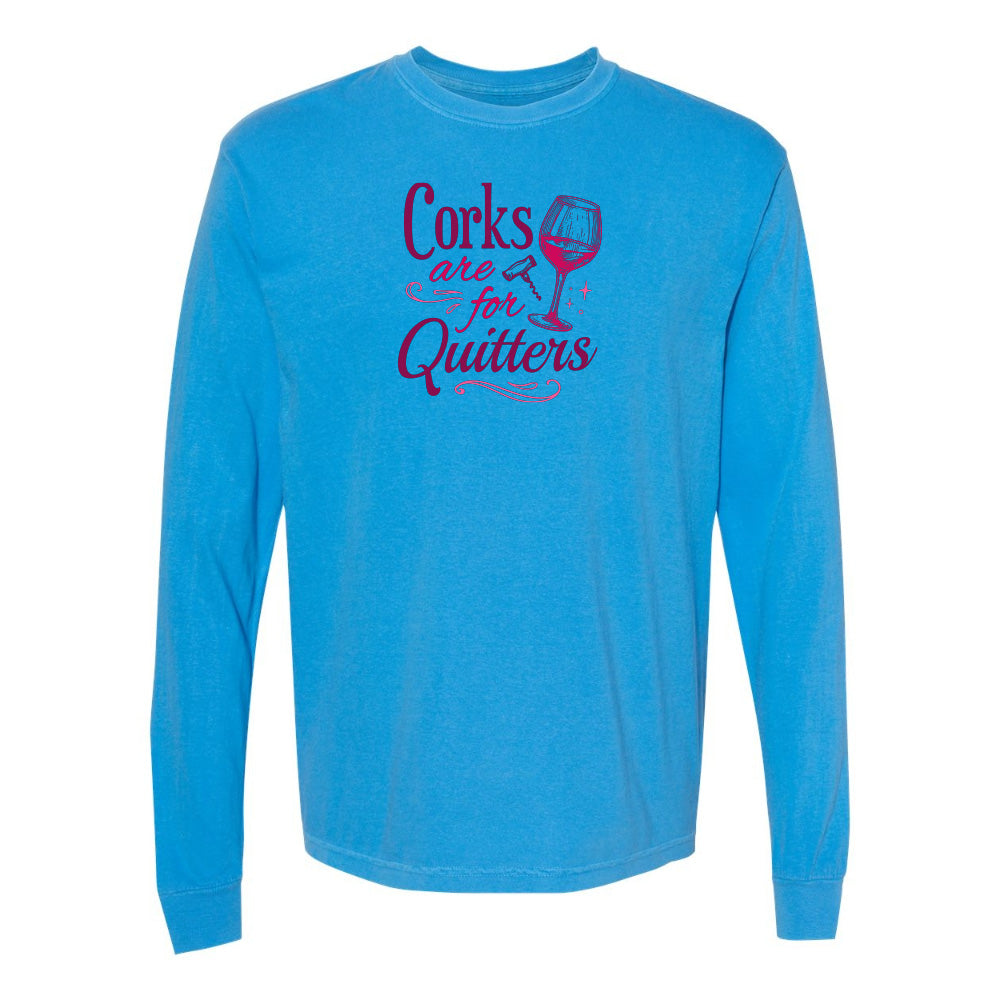 Blue long-sleeve shirt with text and wine glass graphic on a white background