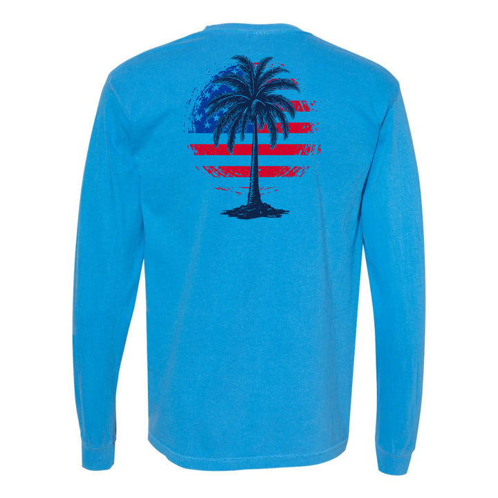 Blue long-sleeve shirt with a palm tree design on the back against a white background