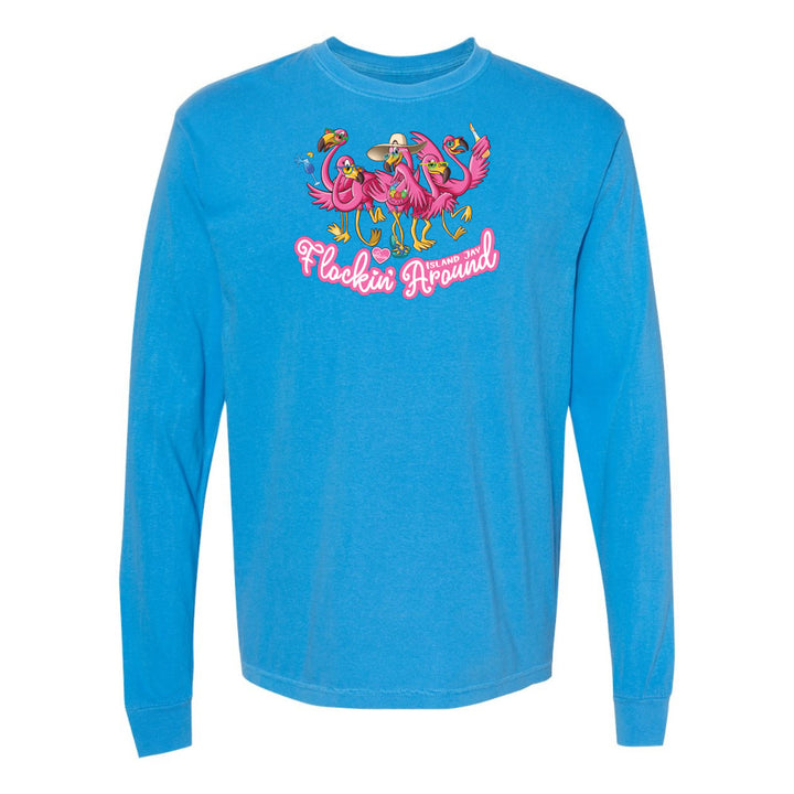 Blue long-sleeve shirt with flamingo design and text on a white background