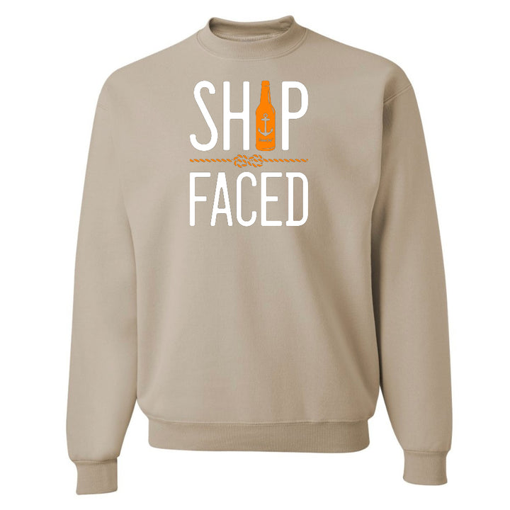 Beige sweatshirt with 'Ship Faced' text and bottle graphic on a white background