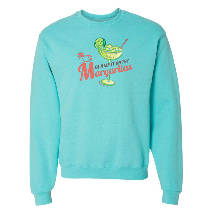 Turquoise sweatshirt with a graphic of a margarita and text 'Blame it on the Margaritas' on a white background