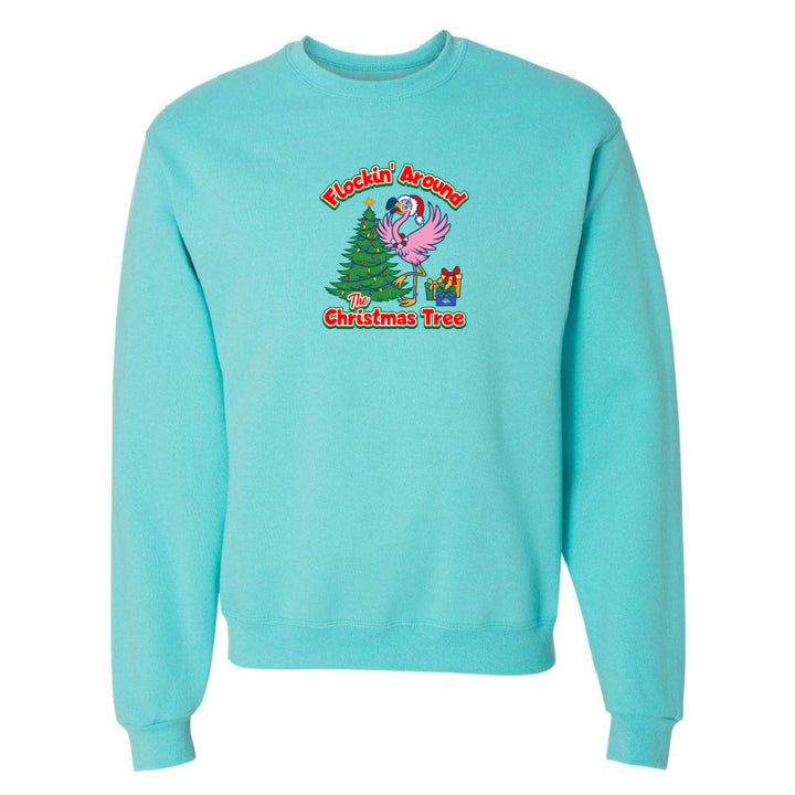 Turquoise sweatshirt with a Christmas-themed graphic on a white background