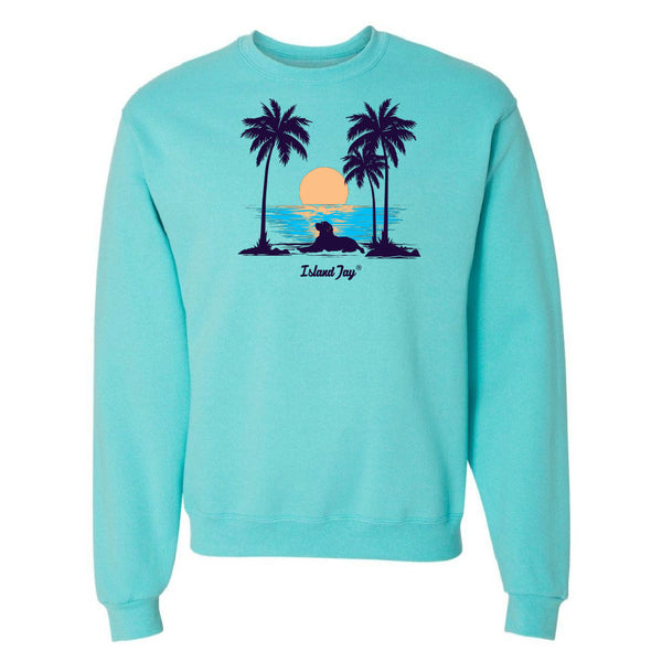 Light blue sweatshirt with a tropical graphic of palm trees and a sunset on a white background